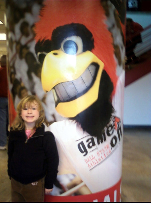 A young Janet posed for a picture next to Ball State's mascot Charlie Cardinal. (Photo Provided)