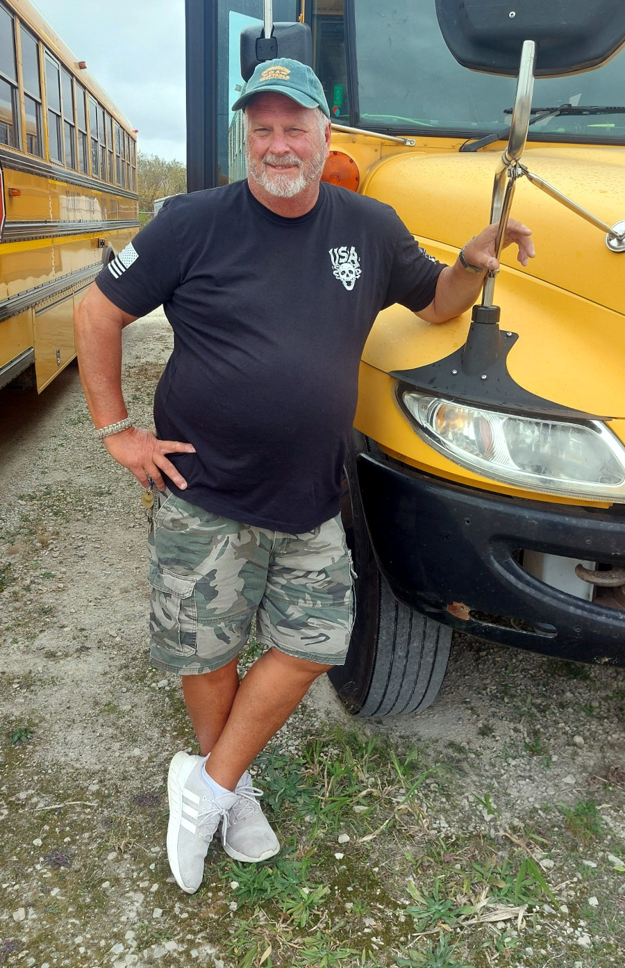 Driver leaning on bus