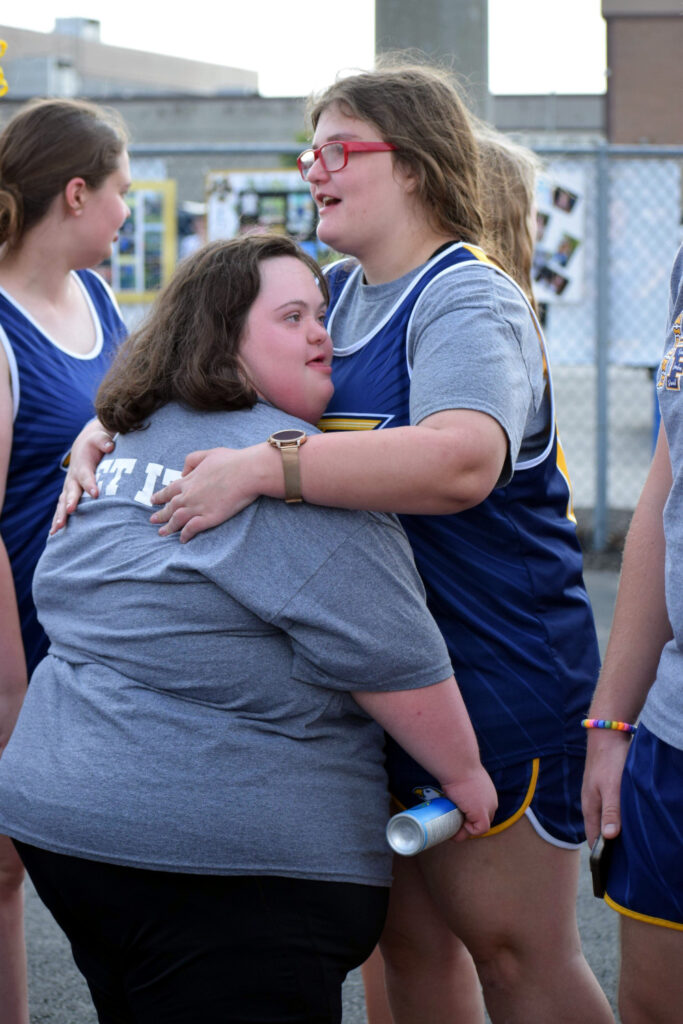 Athletes hug